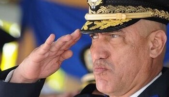 Honduras' former head of police, "El Tigre" Bonilla, saluting